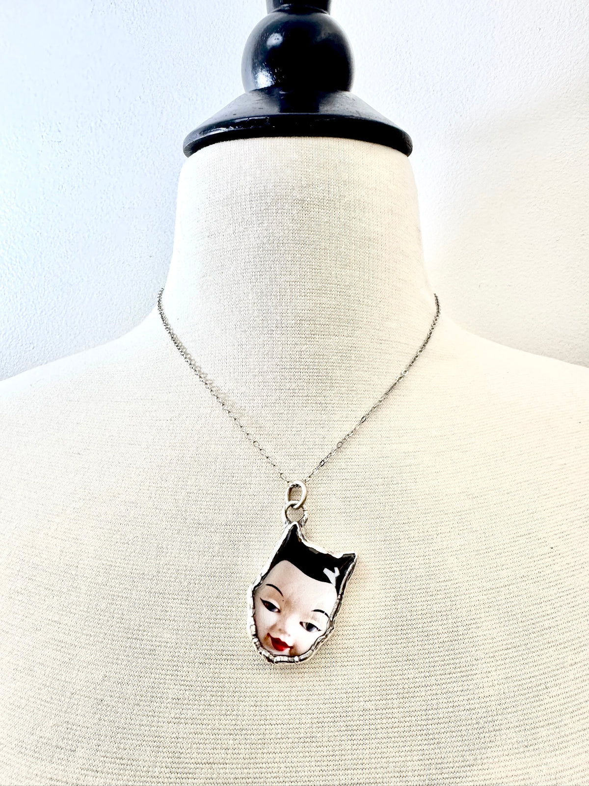 side eye doll head necklace, fine silver