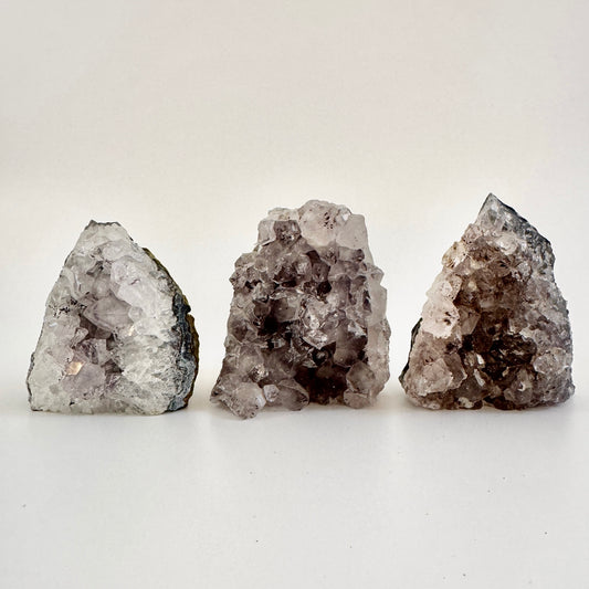 Self-standing amethyst geode crystal cluster from FoxlarkCrystals with vibrant purple crystals and natural rock base.
