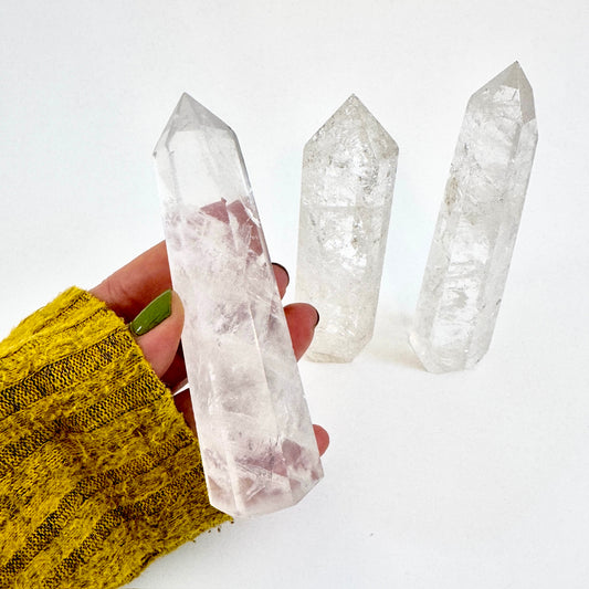 Self-standing clear quartz crystal point from FoxlarkCrystals, showcasing a natural polished quartz with pointed tip.