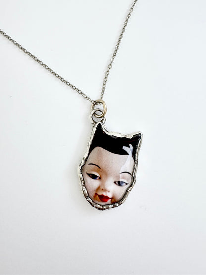 side eye doll head necklace, fine silver