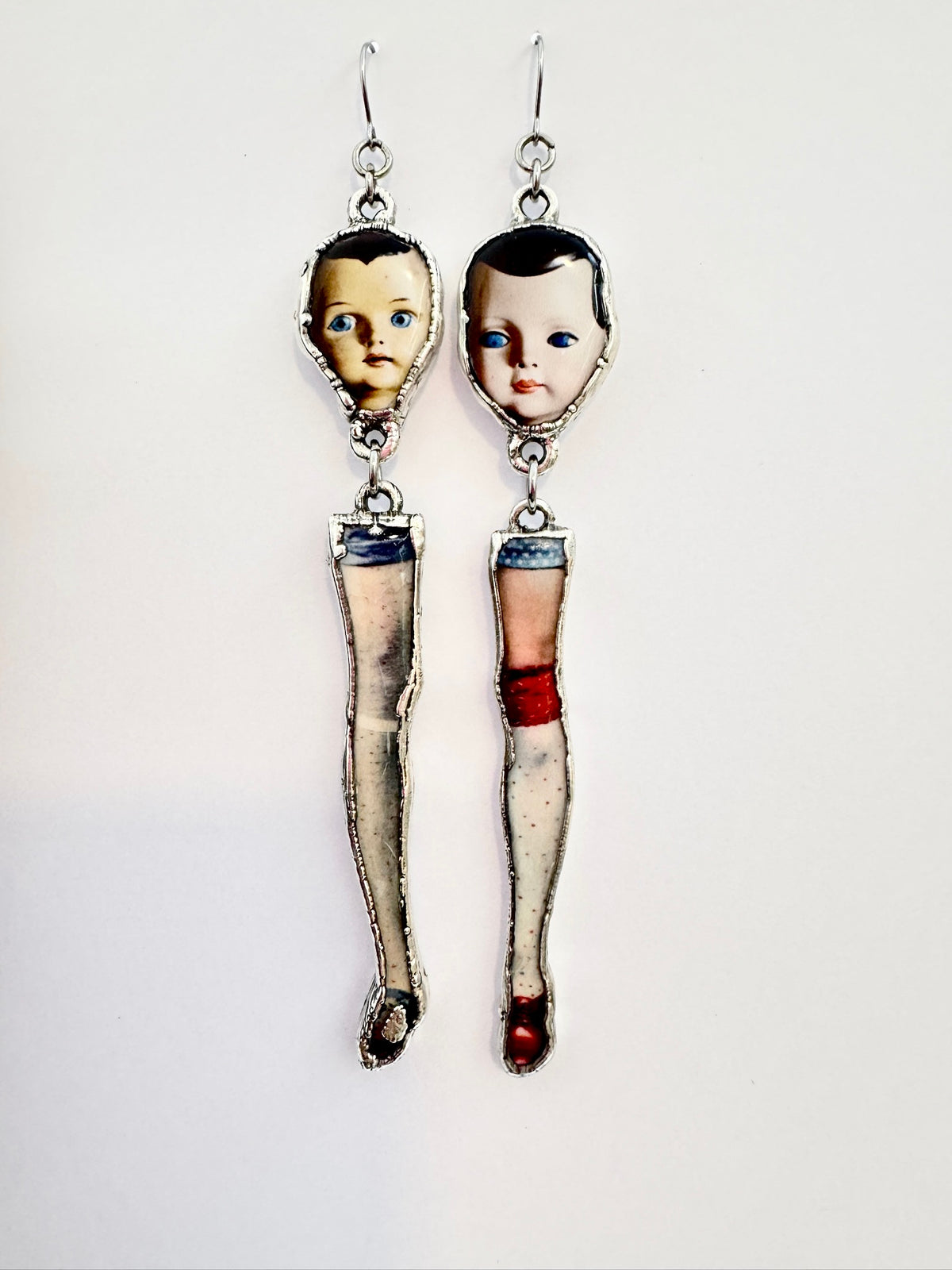 mismatched doll head and leg dangle earrings, silver