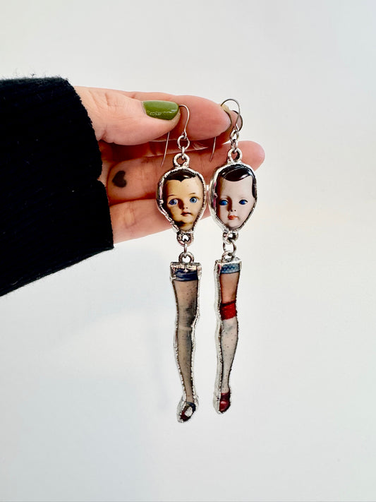 mismatched doll head and leg dangle earrings, silver