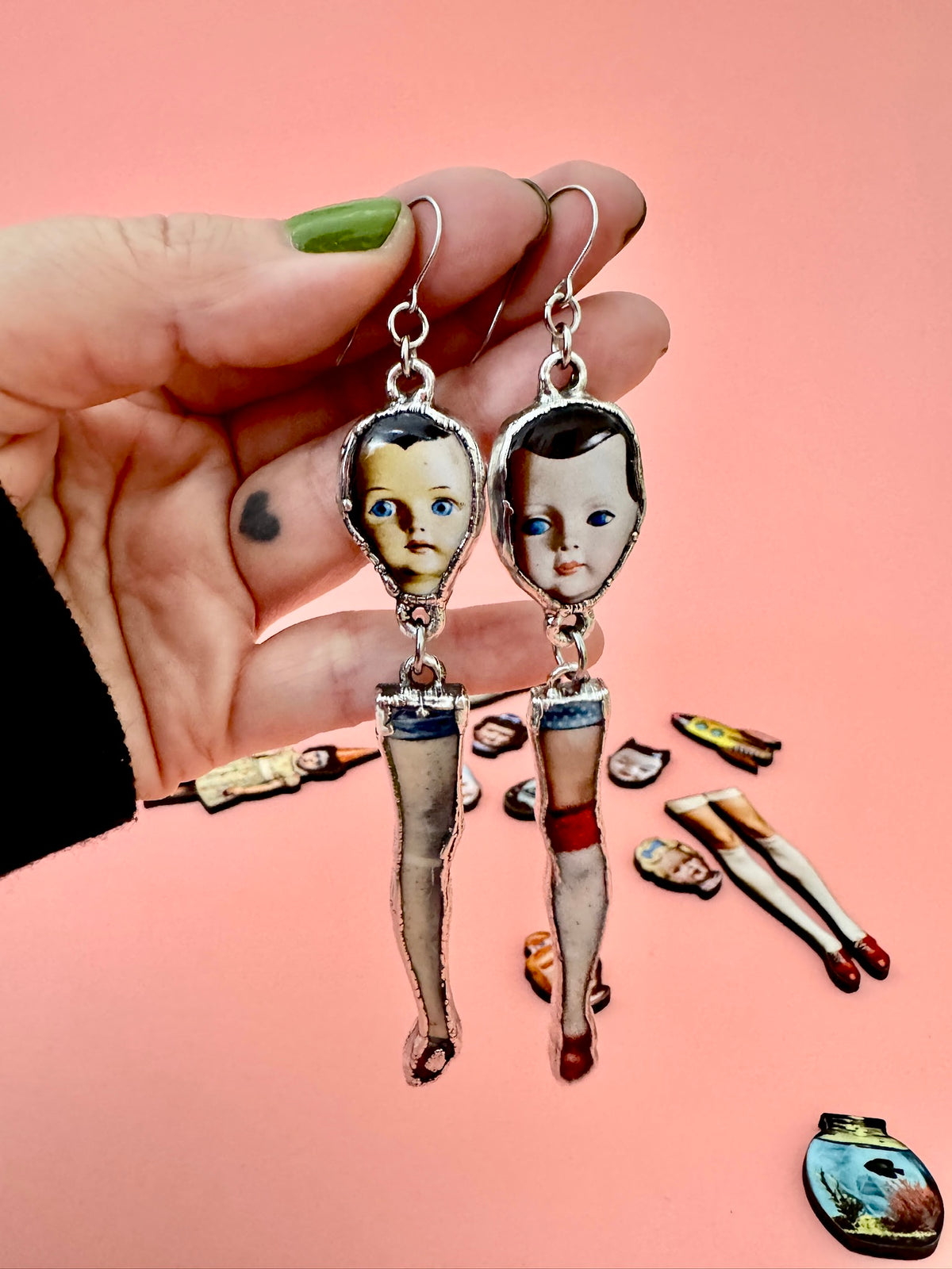 mismatched doll head and leg dangle earrings, silver