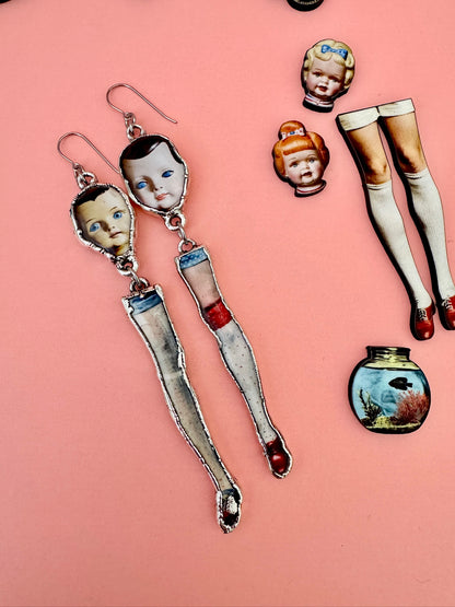 mismatched doll head and leg dangle earrings, silver