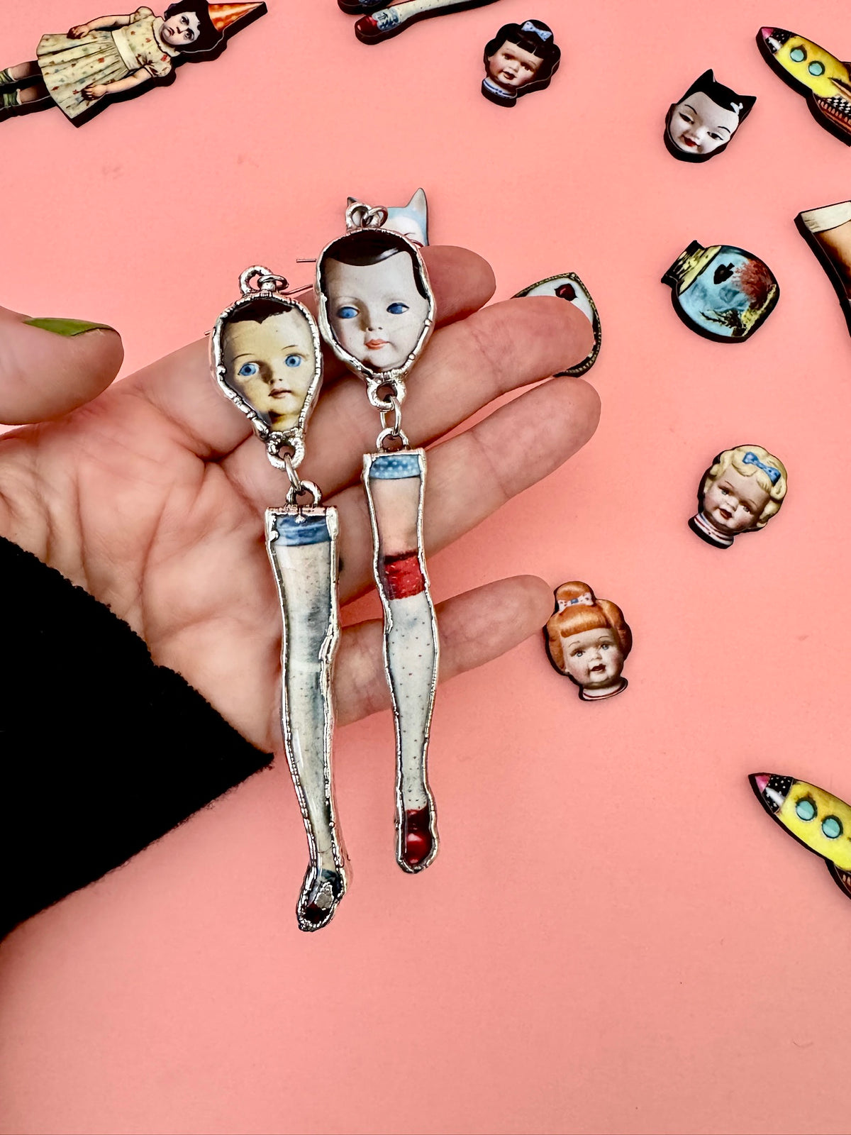 mismatched doll head and leg dangle earrings, silver